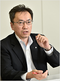 吉岡 栄一 氏